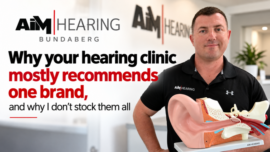 AIM Hearing Bundaberg clinician holding a hearing aid, with the heading "Why your hearing clinic mostly recommends one brand, and why I don’t stock them all"